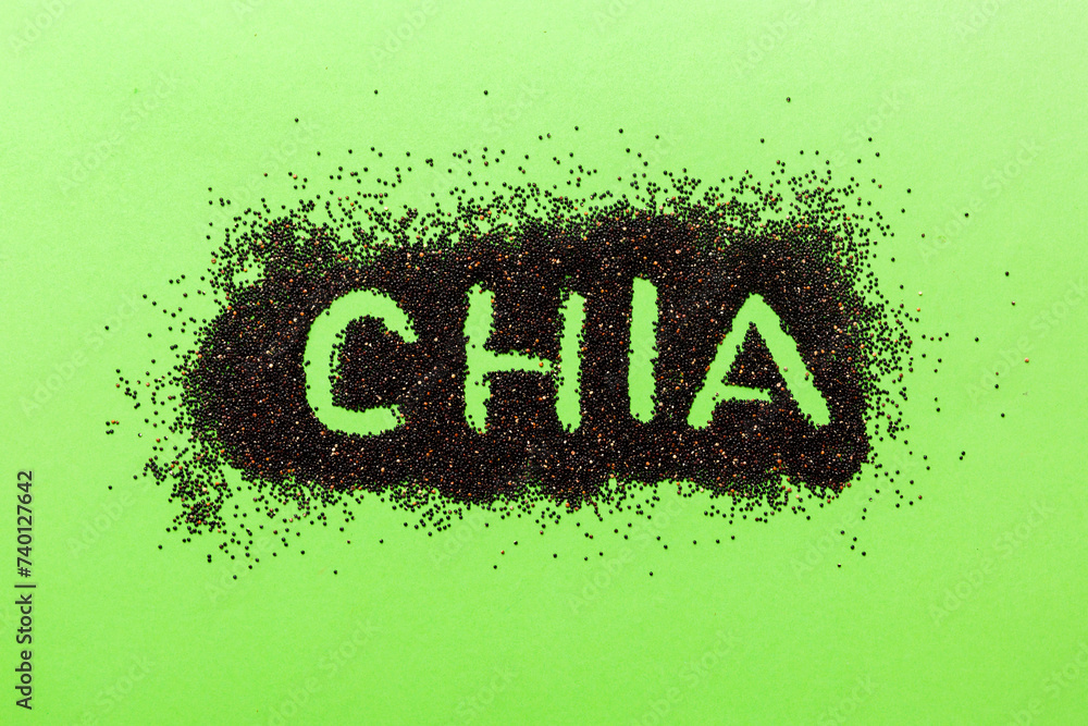 Wall mural chia word made from chia seeds top view on colored background. Healthy superfood - Wall murals