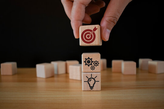 Business goal, plan, action. wooden cubes with icon business strategies, action plan, goal, process, game plan, Business strategies and achieving goals, Business challenge, wooden cube.