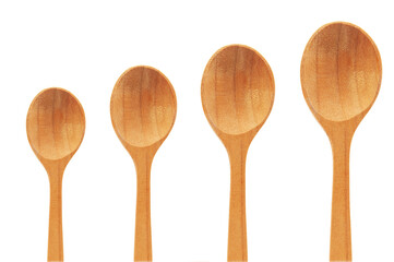 carved wooden spoon on a white background. the concept of manufacturing historical objects	