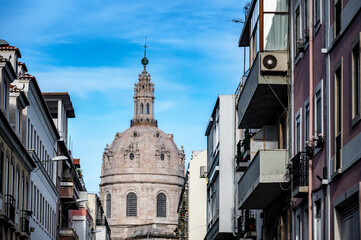 Fototapeta na wymiar View of a row of buildings leading to the Estrela Basilica in Lisbon, Portugal