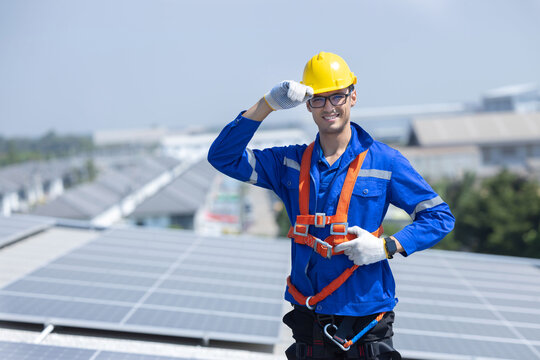 Engineer pose on solar parnels factory roof