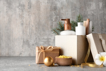 Composition with spa accessories, Christmas gift and decor on grunge background