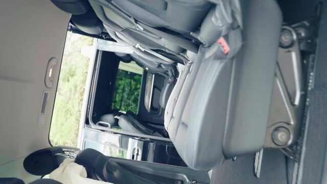 Camera spinning in a circle along two open passenger vans parked near the luxury hotel, premium class cars for rent, black automobiles with exclusive interior design, luxury cars for rent