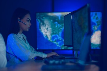 Photo of a successful dispatcher working on a computer in the office