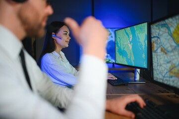 Diverse call center operators team use computers consulting clients in office