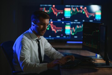 Obraz na płótnie Canvas Crypto trader investor analyst looking at computer screen analyzing financial