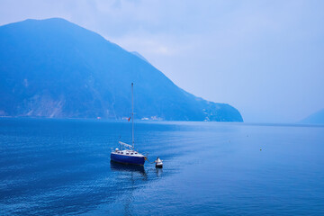 The small boat is tied up to the buoy, Lugano Lake, Lugano, Switzerland