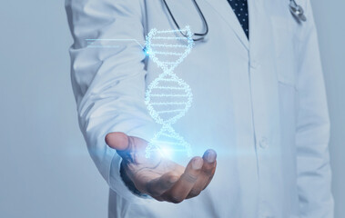 Medical doctor genetic holding DNA chain in his hand