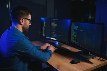 programmer working at desk in office