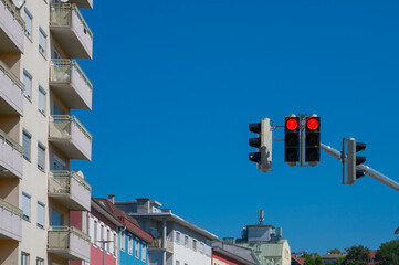 red traffic light in city landscape