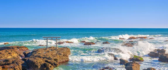 Gordijnen Torii Gates Panorama view one of the tourist attraction in Japan, Torii gates of Oarai Isosaki-jinja by the sea in bright blue sky day  © kardd