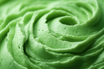 Fototapeta premium Macro shot revealing the glossy sheen and smooth texture of vibrant green frosting swirls