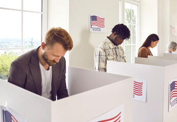 Portrait of a group of young happy diverse American citizens people men and women standing at vote...