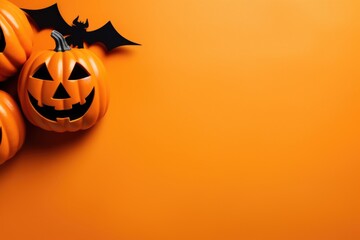 Pumpkins and bats on an orange background, perfect for Halloween projects