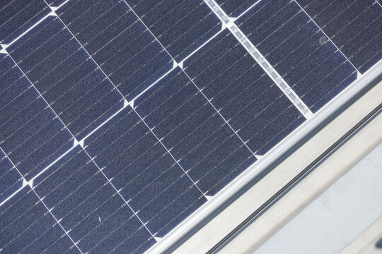 Top view of solar panels of a factory rooftop