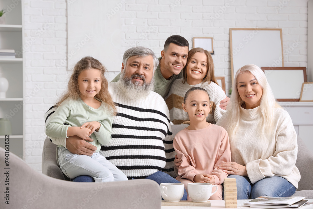 Sticker big family sitting on sofa at home