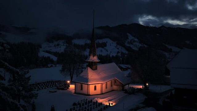 Illuminated Church Building in Alpine Town at Night Lights