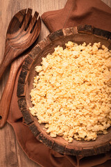 cooked couscous, in a wooden bowl, top view, no people,