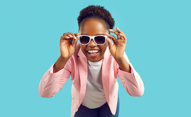 Portrait of happy beautiful woman in stylish outfit. Cheerful young African American girl wearing...