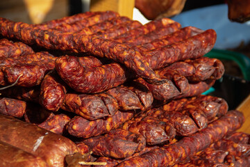 Serbian traditionally made and smoke dried sausages on a farmer's market in Kacarevo village, gastro bacon and dry meat products festival held yearly in Kacarevo, near Belgrade