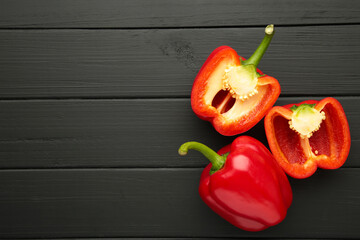 Red sweet pepper on black background. Space for text. Flat lay