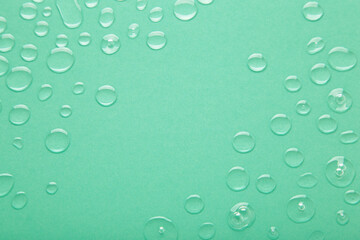 Water drops on mint background. Space for text
