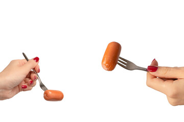 Small sausage on a fork in woman hand isolated.