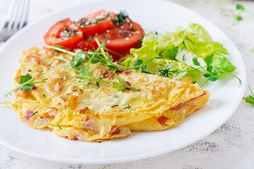 Healthy breakfast.Quesadilla with omelette, bacon  and tomatoes salad. Keto, ketogenic lunch.