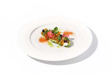 Avocado and tuna tartare on a chic white plate sprinkled with paprika, an exquisite choice for stylish vegetarian starters