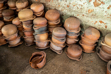 Stack of Handcraft Claypots, Thai Earthware at Pottery Factory at Ko Kret island, Nonthaburi, Thailand.