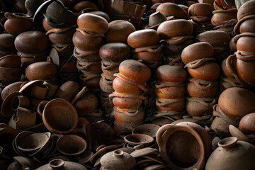 Stack of Handcraft Claypots, Thai Earthware at Pottery Factory at Ko Kret island, Nonthaburi, Thailand.
