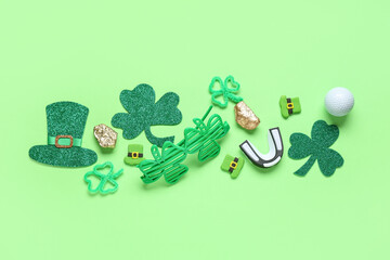 Mouth piece, golf ball and decorations for St. Patrick's Day celebration on green background