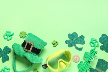 Diving mask and decorations for St. Patrick's Day celebration on green background
