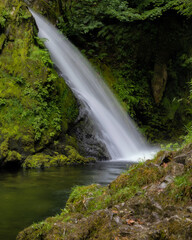 Beautiful serene waterfall cascading through lush green foliage. Ceunant Mawr Waterfall, also known as Llanberis Falls in North Wales 