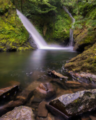 Beautiful serene waterfall cascading through lush green foliage. Ceunant Mawr Waterfall, also known as Llanberis Falls in North Wales 
