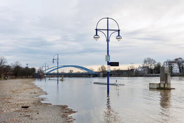Flooded riverside Magdeburg embankment promenade Submerged street lamp posts Bridge Background....
