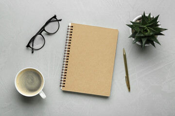 Flat lay composition with notebook on light textured table