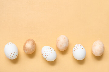 Painted Easter eggs on beige background