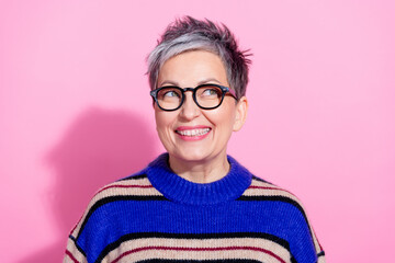 Portrait of funky woman with short hairdo wear striped pullover in glasses look at promo empty...