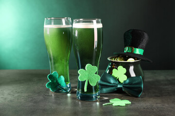St. Patrick's day celebration. Green beer, leprechaun hat, pot of gold and decorative clover leaves...
