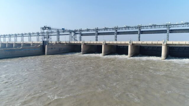 Aerial view of Head Taunsa Barrage is a barrage on the Indus River in Tehsil Taunsa, Dera Ghazi Khan District, Punjab Province, Pakistan. Where a lot of water is stored. Beautiful drone 4K view.