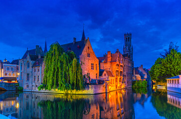 Naklejka premium Bruges cityscape, Brugge old town scenic view, Bruges historical city centre, Rosary Quay Rozenhoedkaai embankment, Belfort Belfry tower, Dijver water canal, evening view, West Flanders, Belgium