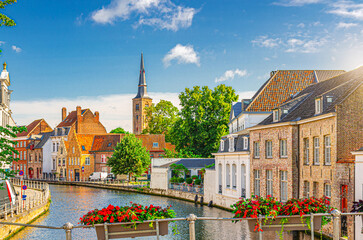 Bruges cityscape, Sint Annarei water canal, houses buildings on promenade in Brugge old town,...