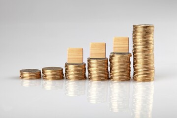 Stacks of coins and ETF text on wooden cubes