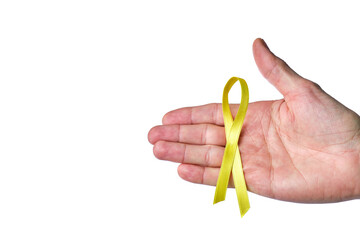 male hand with yellow ribbon in fight against suicide on white background