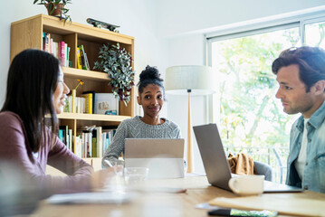 Group of coworkers gathered together at office