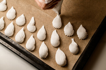 Pastry bag at work. Shaping delightful sweets with expertise