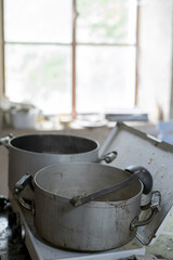 Fototapeta premium Two cooking pots inside kitchen