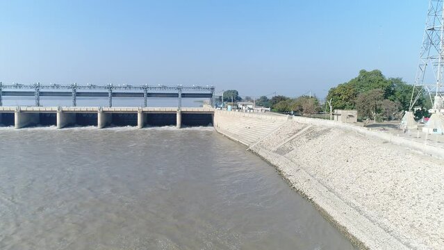 Aerial view of Head Taunsa Barrage is a barrage on the Indus River in Tehsil Taunsa, Dera Ghazi Khan District, Punjab Province, Pakistan. Where a lot of water is stored. Beautiful drone 4K view.