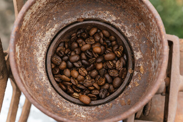 Coffee beans ready to be ground in a grinding machine.